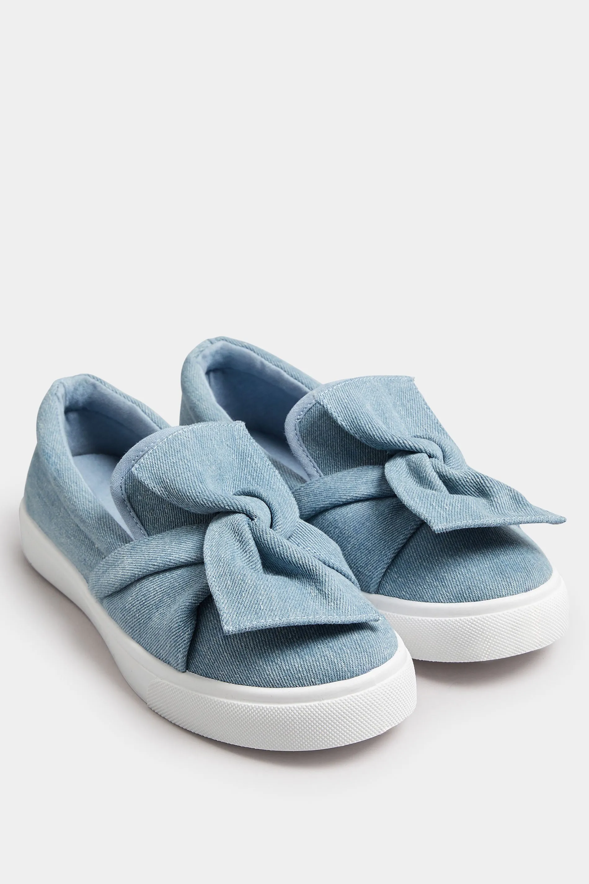 Blue Denim Twisted Bow Slip-On Trainers In Wide E Fit