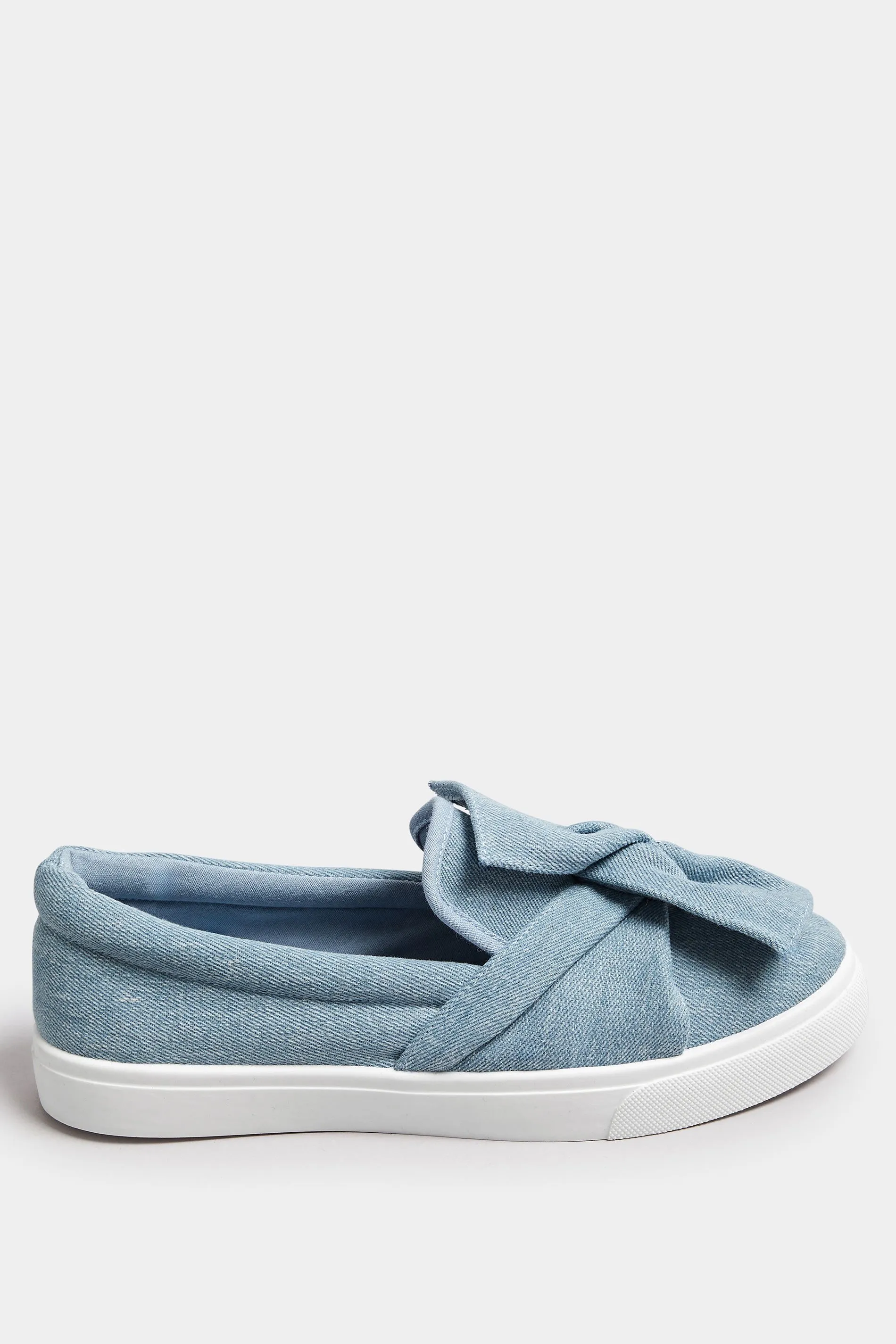 Blue Denim Twisted Bow Slip-On Trainers In Wide E Fit