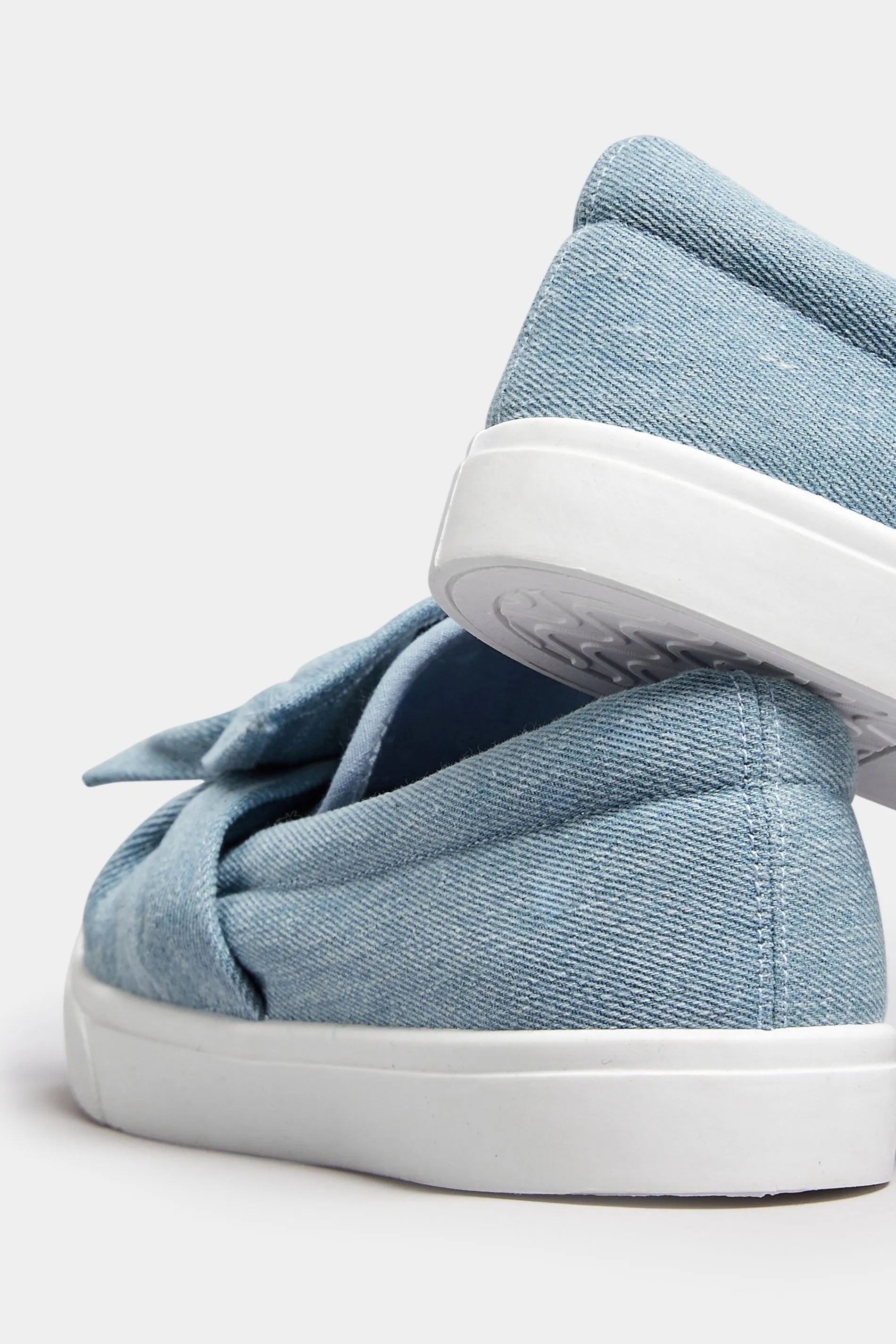 Blue Denim Twisted Bow Slip-On Trainers In Wide E Fit